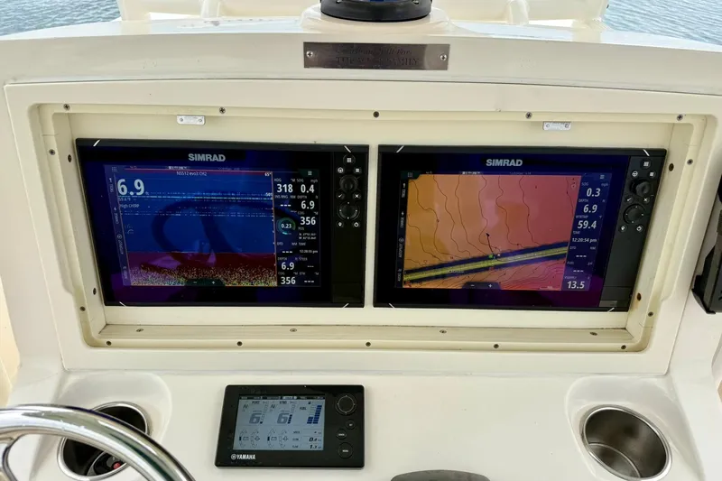  Yacht Photos Pics Control panel of a 2019 Young Boats 27 with dual Simrad displays.