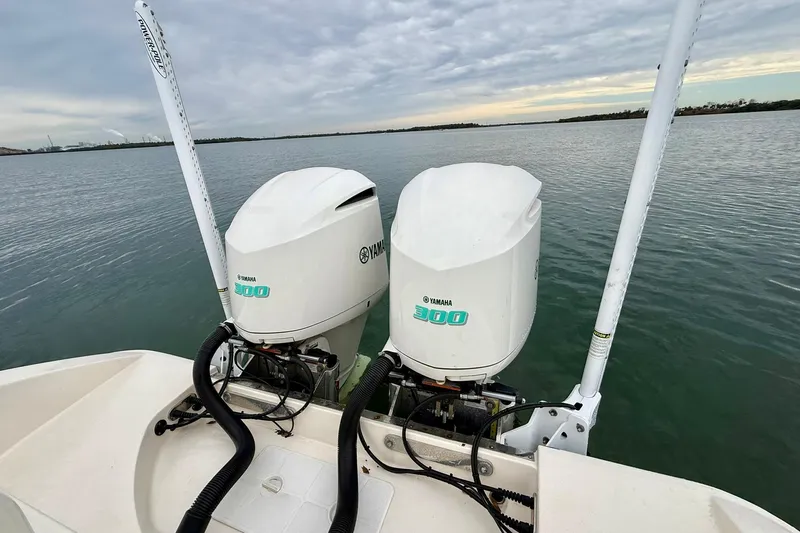  Yacht Photos Pics Twin Yamaha 300 engines on a 2019 Young Boats 27, overlooking calm waters.