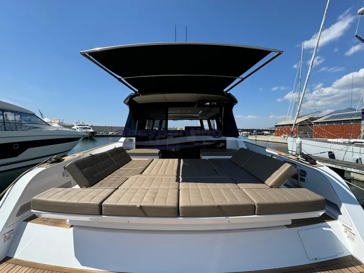  Yacht Photos Pics 2022 Pardo Yachts GT52 with spacious deck and seating, docked under clear blue sky.
