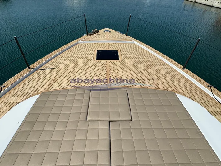  Yacht Photos Pics 2022 Pardo Yachts GT52 deck with cushioned seating, overlooking calm water.