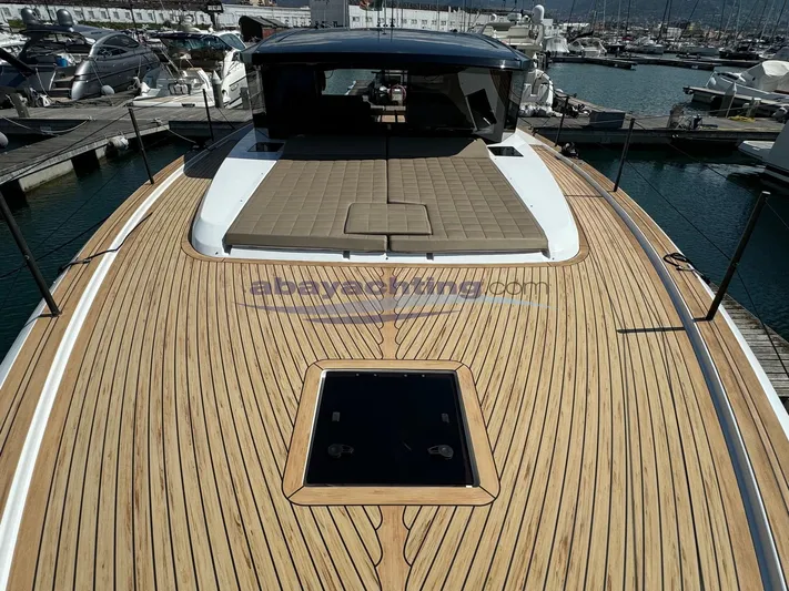  Yacht Photos Pics 2022 Pardo Yachts GT52 with sleek teak deck and spacious sunbathing area.