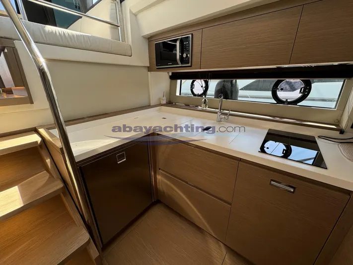  Yacht Photos Pics Modern kitchen in 2022 Pardo Yachts GT52 with sleek cabinetry and appliances.