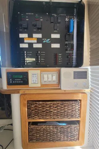 Backatcha Yacht Photos Pics Control panel of a 1995 Sea Ray 440 Express Bridge yacht with storage baskets.
