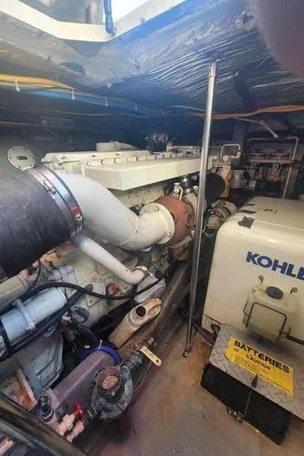 Backatcha Yacht Photos Pics Engine room of 1995 Sea Ray 440 Express Bridge with Kohler generator and batteries.