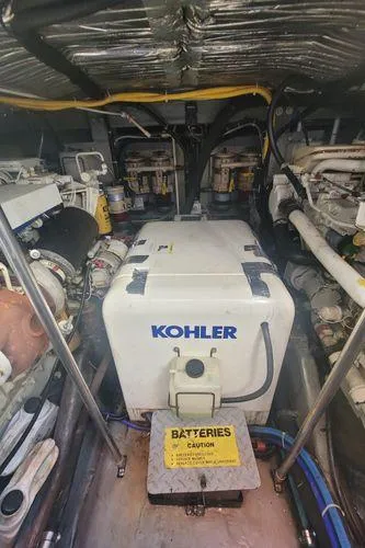 Backatcha Yacht Photos Pics Engine room of 1995 Sea Ray 440 Express Bridge with Kohler generator.