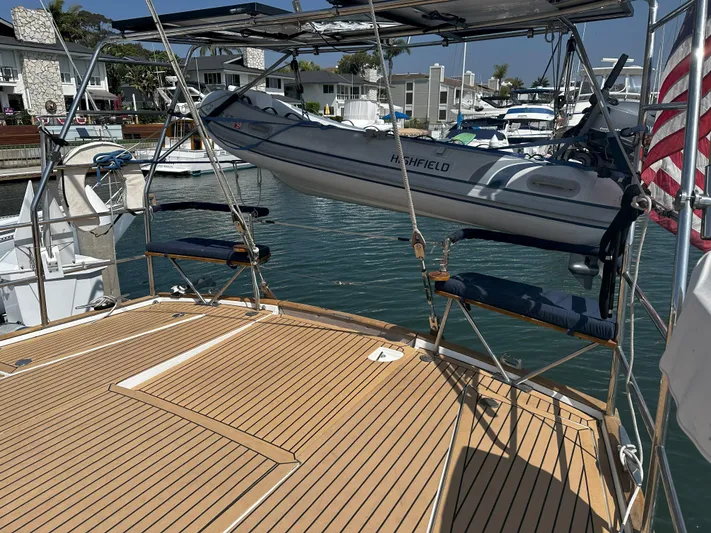 2.0 Impulsive Yacht Photos Pics Beneteau 57 yacht deck with dinghy, docked in a marina, 2005 model.
