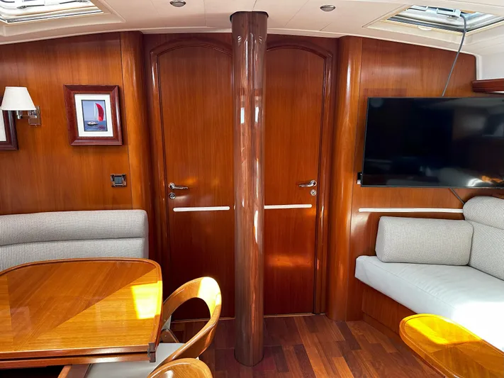 2.0 Impulsive Yacht Photos Pics Luxurious 2005 Beneteau 57 yacht interior with wood finish and modern amenities.