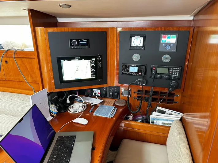 2.0 Impulsive Yacht Photos Pics Navigation station inside 2005 Beneteau 57 yacht with electronics and laptop.