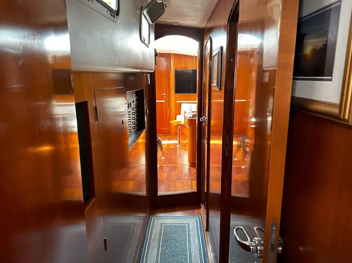 2.0 Impulsive Yacht Photos Pics Interior of 2005 Beneteau 57 yacht with polished wood finish and modern design.