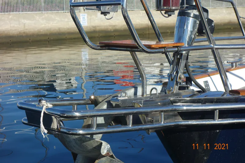 2.0 Impulsive Yacht Photos Pics Close-up of a 2005 Beneteau 57 yacht's bow and anchor in a marina.