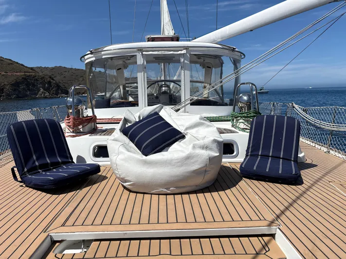 2.0 Impulsive Yacht Photos Pics Deck of 2005 Beneteau 57 yacht with seating and ocean view.