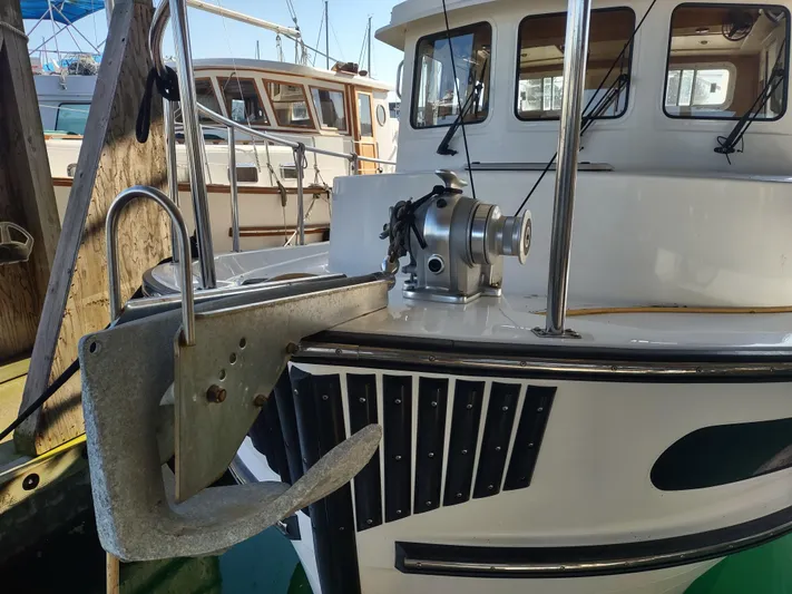 Santosha Yacht Photos Pics 2006 Nordic Tug 32 boat with anchor and winch at dock.