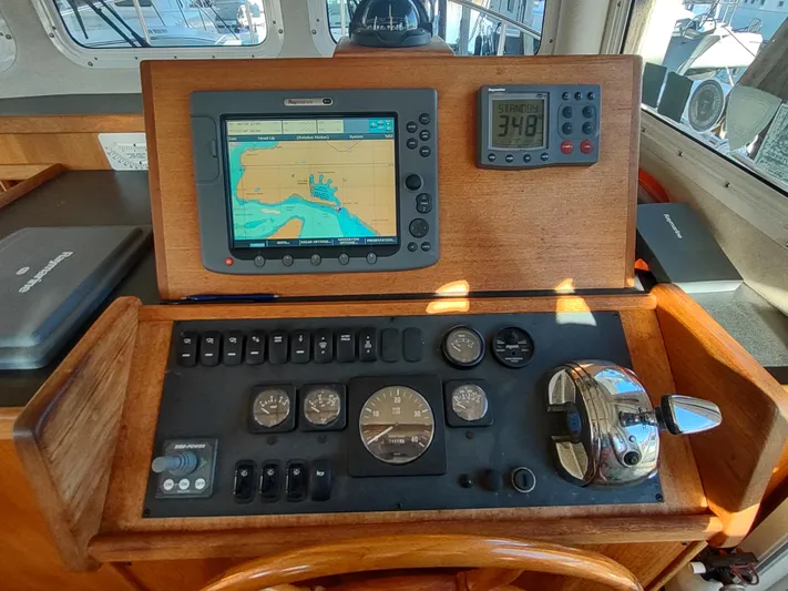 Santosha Yacht Photos Pics Control panel of a 2006 Nordic Tug 32 with navigation equipment.