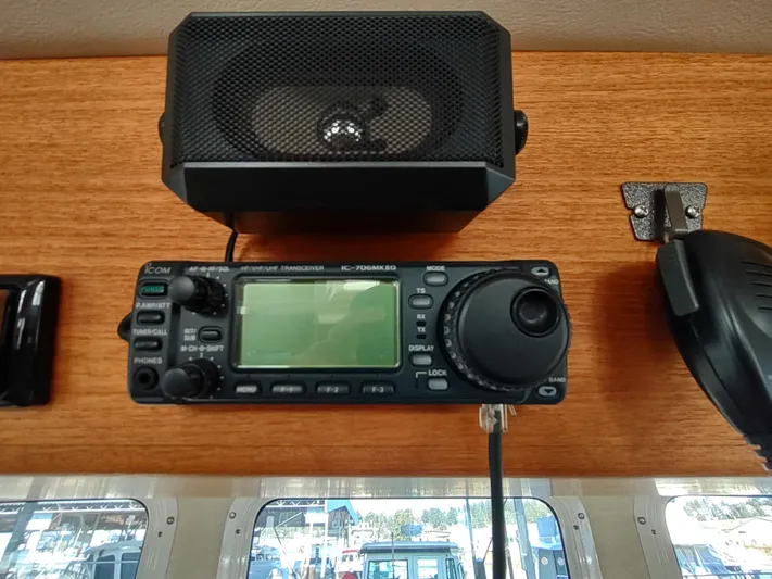 Santosha Yacht Photos Pics Marine radio and speaker on 2006 Nordic Tug 32 boat dashboard.