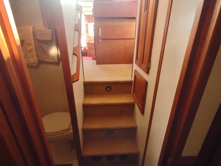 Santosha Yacht Photos Pics Interior of 2006 Nordic Tug 32, featuring stairs and compact bathroom.
