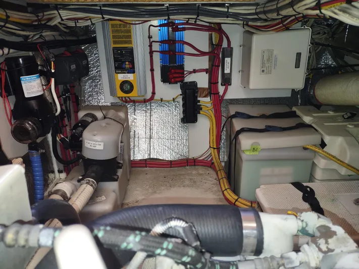 Santosha Yacht Photos Pics Engine room of a 2006 Nordic Tug 32, showcasing wiring and mechanical components.