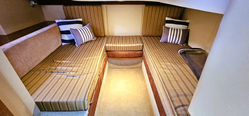  Yacht Photos Pics 2007 Meridian 341 Sedan cabin interior with striped cushions and pillows.