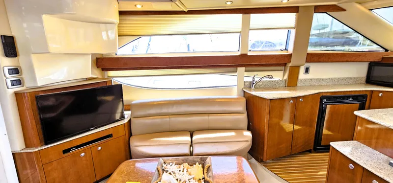  Yacht Photos Pics Luxurious interior of a 2007 Meridian 341 Sedan yacht with leather seating and modern amenities.