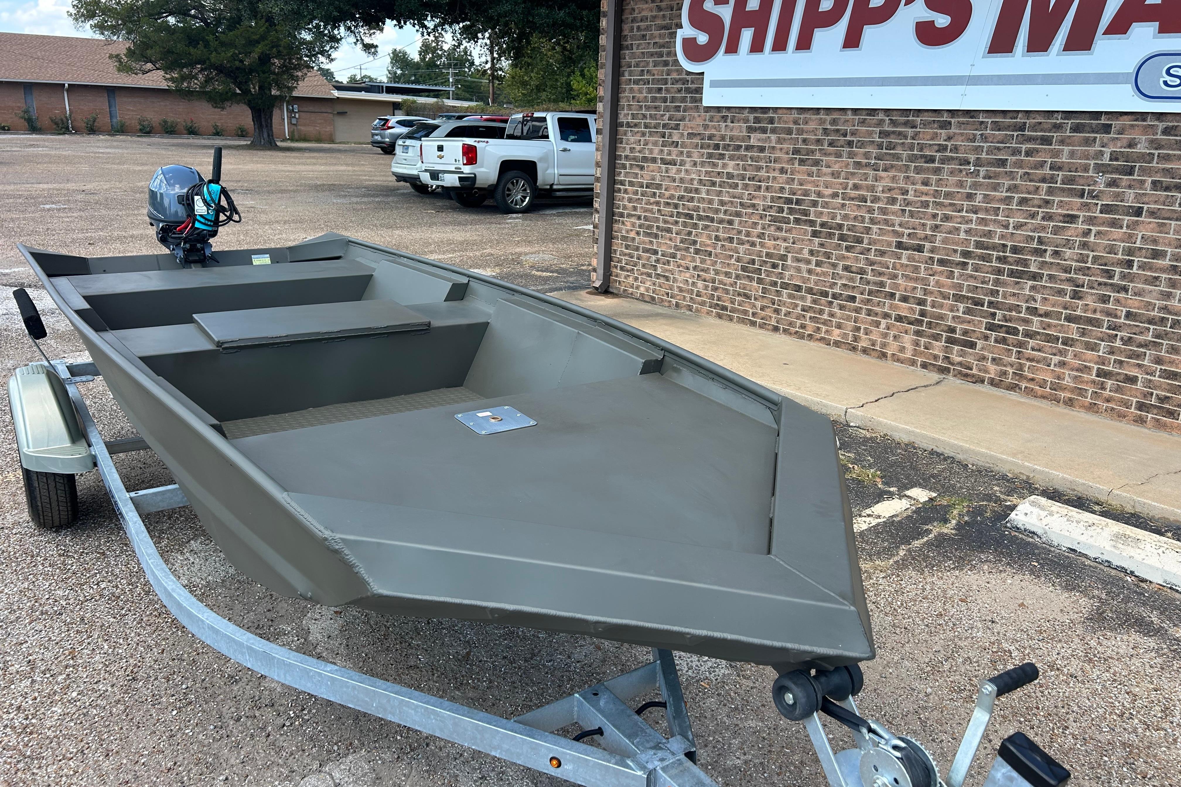 2025 WeldBilt 1648 boat on trailer, parked outside Shipp's Marine building.