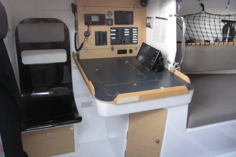 Rush Yacht Photos Pics 2018 Jeanneau Sun Fast 3600 navigation station with control panel and seating.