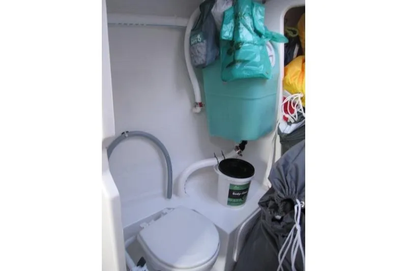 Rush Yacht Photos Pics Compact bathroom in 2018 Jeanneau Sun Fast 3600 sailboat with storage and toilet.