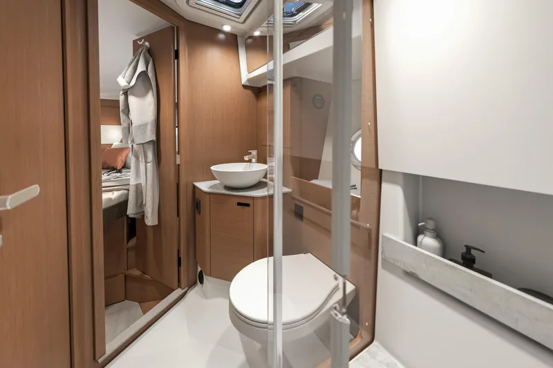  Yacht Photos Pics Luxurious bathroom interior of 2026 Beneteau Swift Trawler 37 Fly yacht.