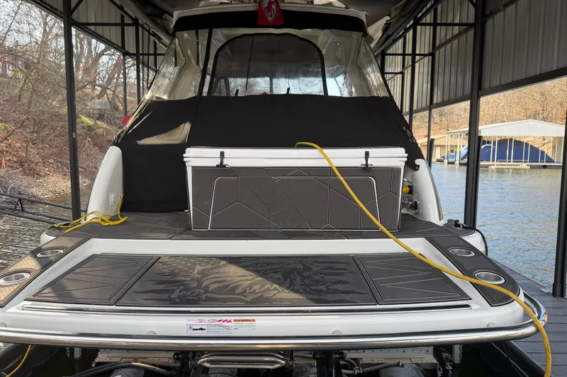  Yacht Photos Pics 2021 Formula 350 Crossover Bowrider I/O docked, featuring a spacious deck and cooler.