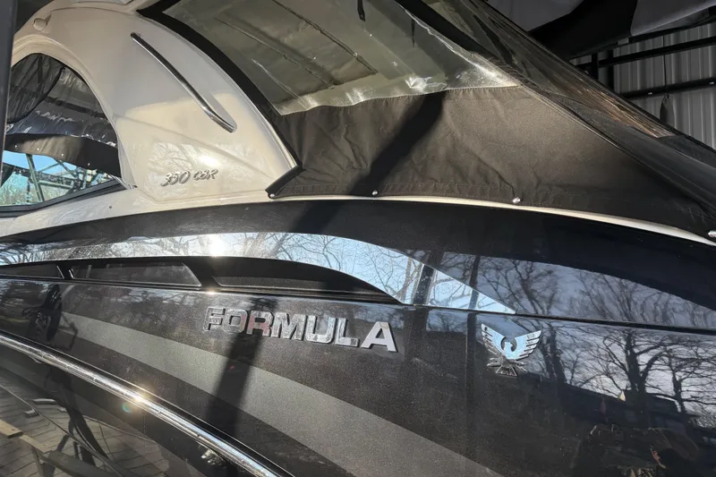  Yacht Photos Pics 2021 Formula 350 Crossover Bowrider I/O boat with sleek black exterior and canopy.