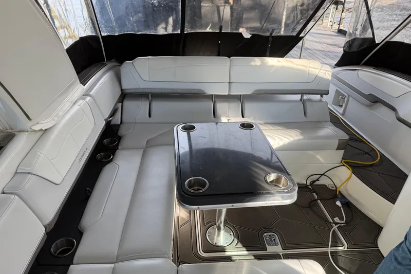  Yacht Photos Pics 2021 Formula 350 Crossover Bowrider I/O interior with seating and table setup.