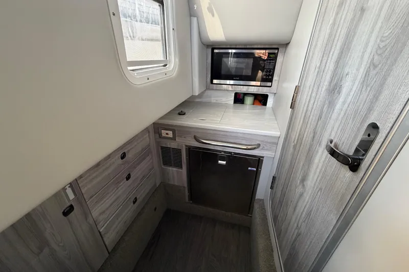  Yacht Photos Pics 2021 Formula 350 Crossover Bowrider I/O cabin with microwave and storage.