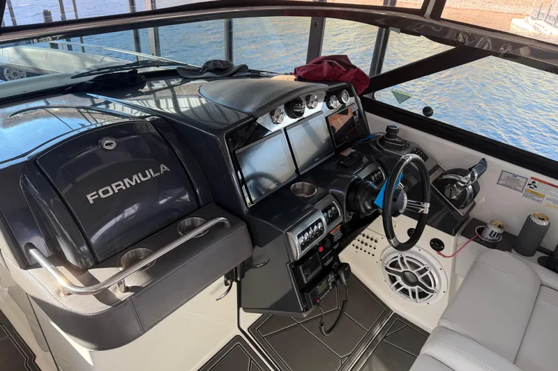  Yacht Photos Pics 2021 Formula 350 Crossover Bowrider I/O cockpit with modern controls and navigation displays.