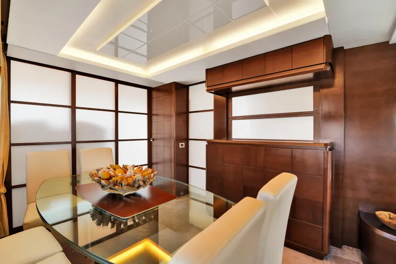  Yacht Photos Pics Luxurious dining area on 2009 Azimut 75 yacht with elegant wood paneling and modern decor.