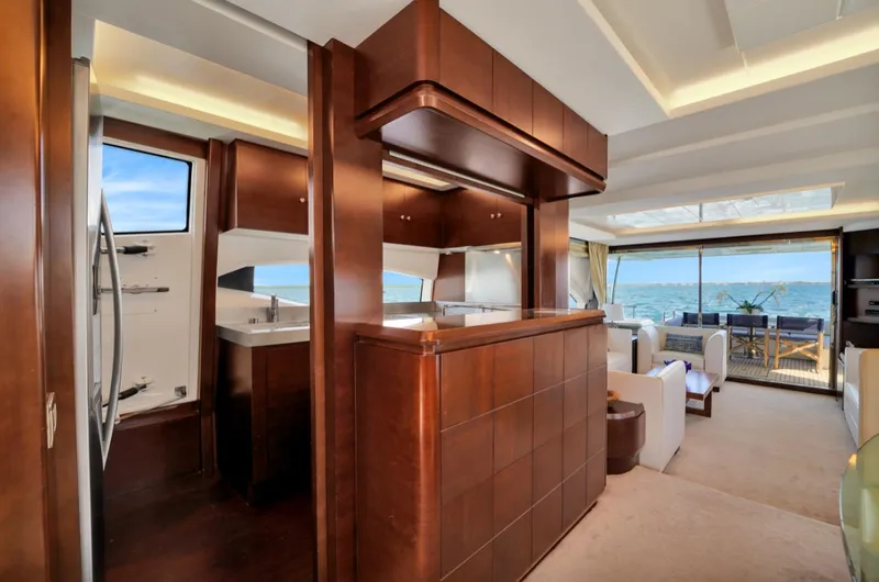  Yacht Photos Pics Luxurious interior of 2009 Azimut 75 yacht with modern wood finishes and ocean view.