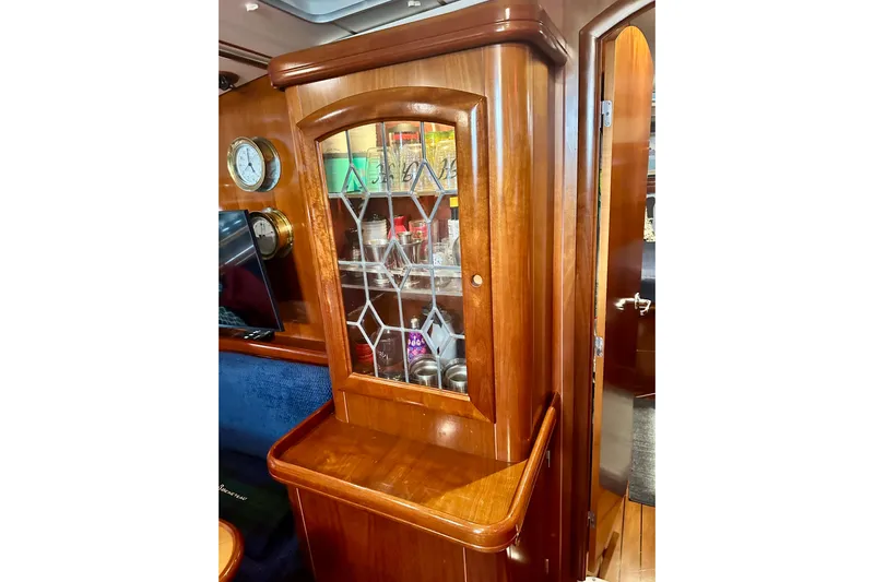  Yacht Photos Pics Luxurious wooden interior of a 2004 Beneteau 50 yacht with glass cabinet.