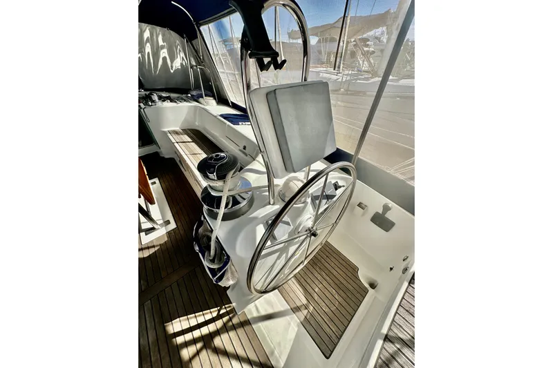  Yacht Photos Pics Steering wheel of a 2004 Beneteau 50 yacht, featuring a sleek cockpit design.