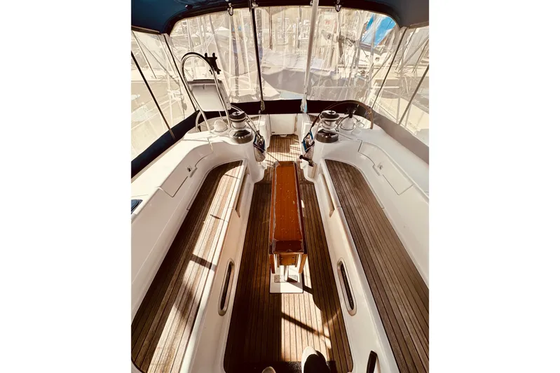  Yacht Photos Pics Cockpit of 2004 Beneteau 50 sailboat with wooden flooring and seating.