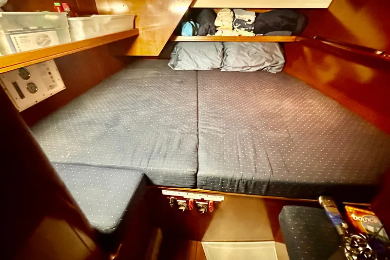  Yacht Photos Pics Cozy cabin interior of 2004 Beneteau 50 sailboat with comfortable bedding.