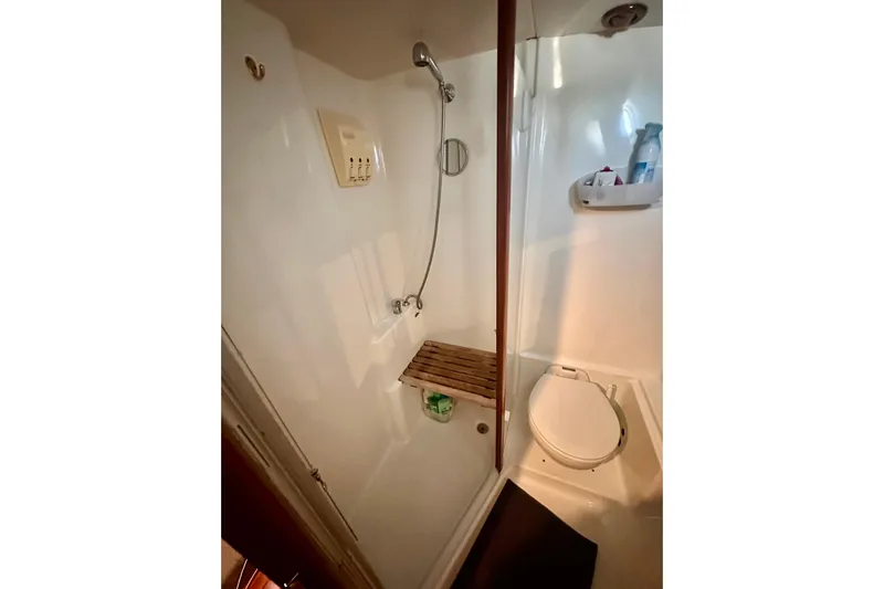  Yacht Photos Pics Bathroom interior of 2004 Beneteau 50 yacht with shower and toilet.