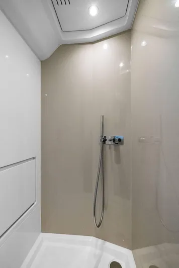 Second Chances Yacht Photos Pics Modern shower area in 2022 Azimut Verve 47 yacht, featuring sleek design and fixtures.