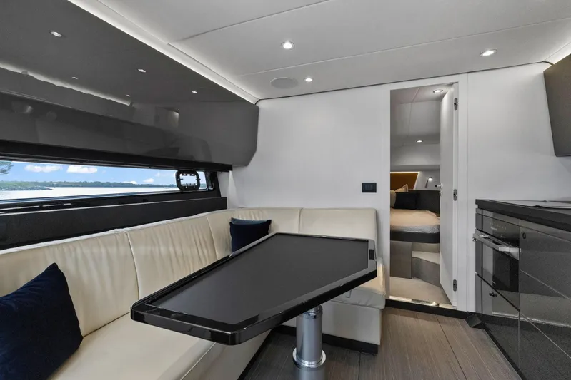Second Chances Yacht Photos Pics Luxurious interior of 2022 Azimut Verve 47 yacht with modern seating and sleek design.