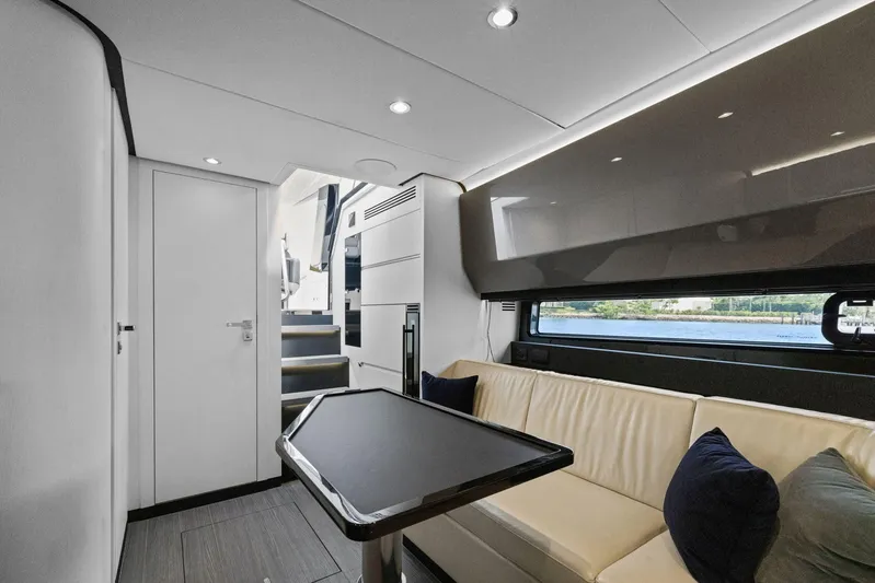 Second Chances Yacht Photos Pics Luxurious interior of 2022 Azimut Verve 47 yacht with modern seating and sleek design.