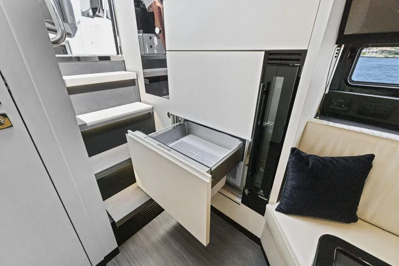Second Chances Yacht Photos Pics Interior of 2022 Azimut Verve 47 yacht with open drawer and seating area.