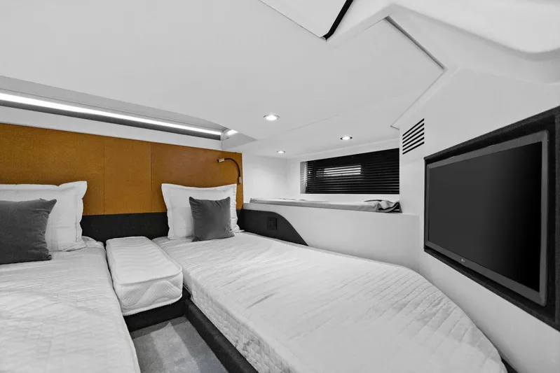 Second Chances Yacht Photos Pics Interior of 2022 Azimut Verve 47 yacht cabin with twin beds and TV.