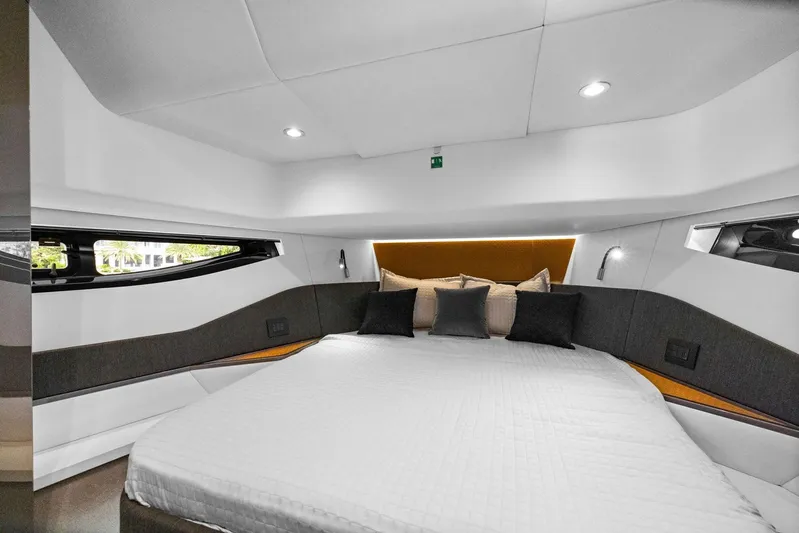 Second Chances Yacht Photos Pics Luxurious interior cabin of 2022 Azimut Verve 47 yacht with modern design and cozy bedding.