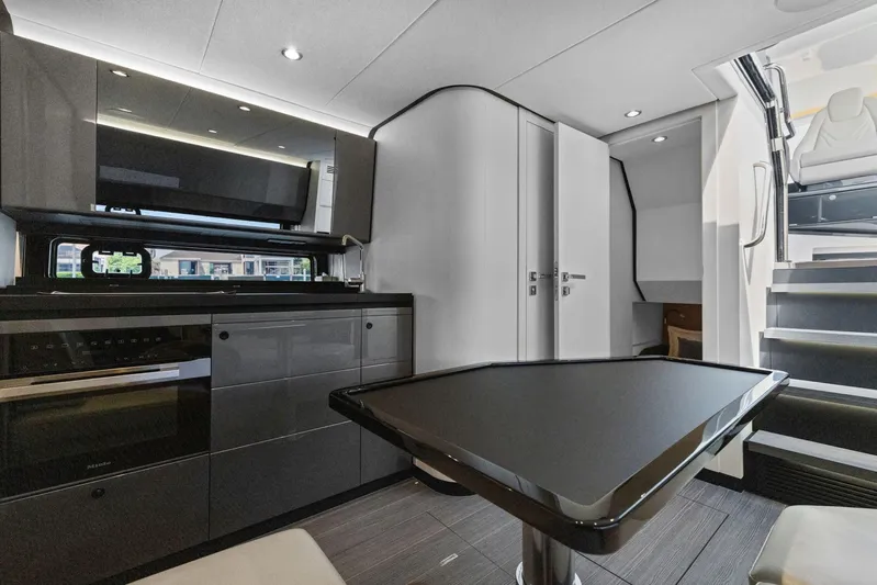 Second Chances Yacht Photos Pics Luxurious interior of 2022 Azimut Verve 47 yacht with modern kitchen and sleek design.