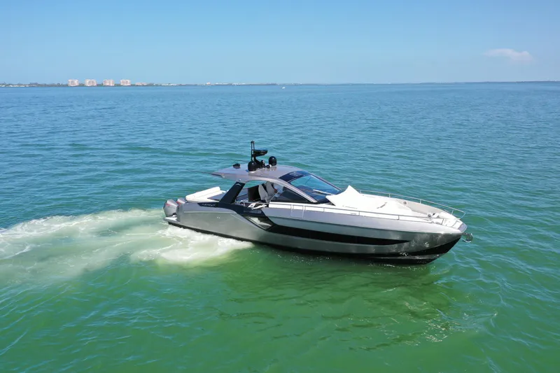 Second Chances Yacht Photos Pics 2022 Azimut Verve 47 yacht cruising on open water under clear blue skies.
