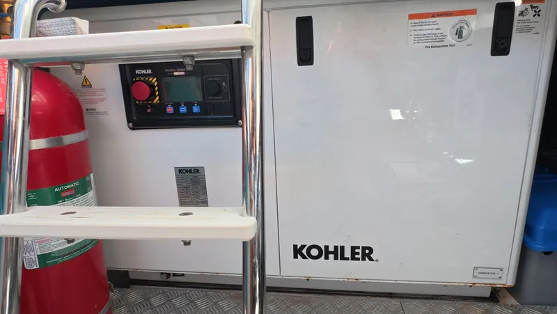 Second Chances Yacht Photos Pics Engine room of 2022 Azimut Verve 47 with Kohler generator and fire extinguisher.
