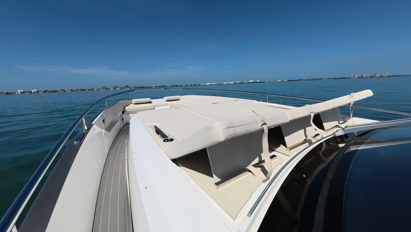 Second Chances Yacht Photos Pics 2022 Azimut Verve 47 yacht deck with sun loungers on calm blue water.