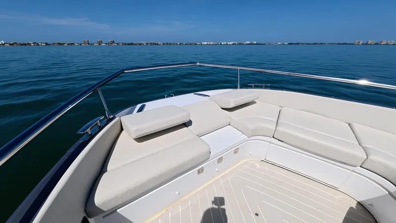 Second Chances Yacht Photos Pics Luxurious seating on 2022 Azimut Verve 47 yacht, overlooking serene ocean view.