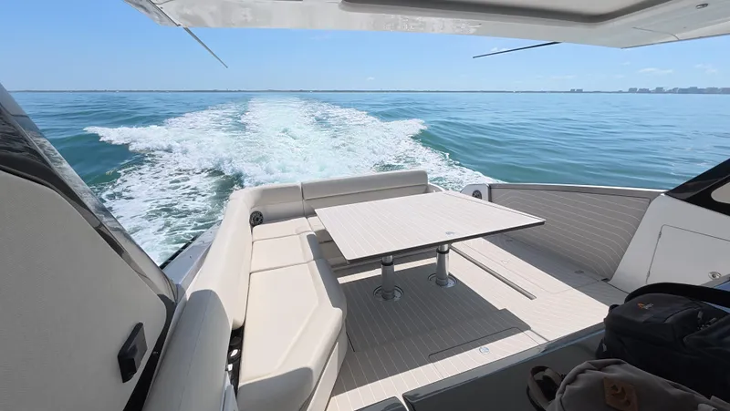 Second Chances Yacht Photos Pics 2022 Azimut Verve 47 yacht cruising on open water, featuring a sleek deck and seating area.